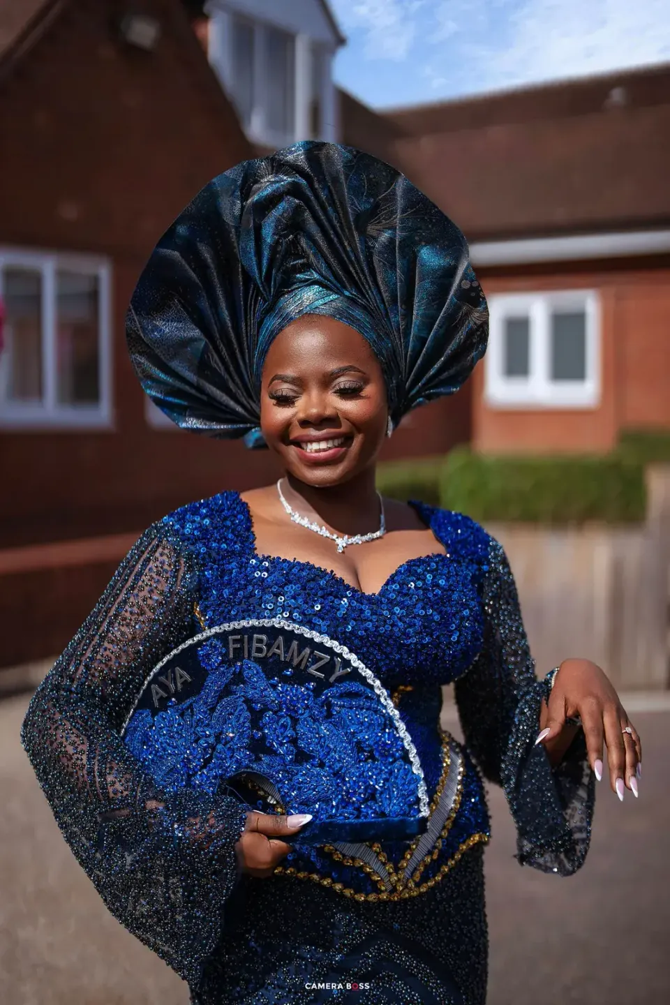 Temi in blue traditional attire. CameraBoss portfolio: Temi and Fiyin.