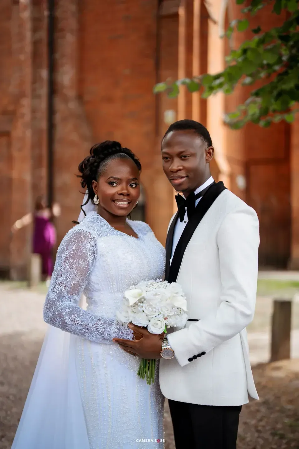 Temi and Fiyin in wedding clothes