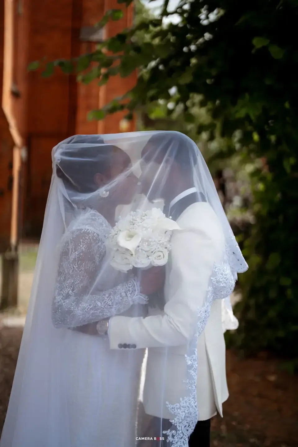 Temi behind her wedding veil