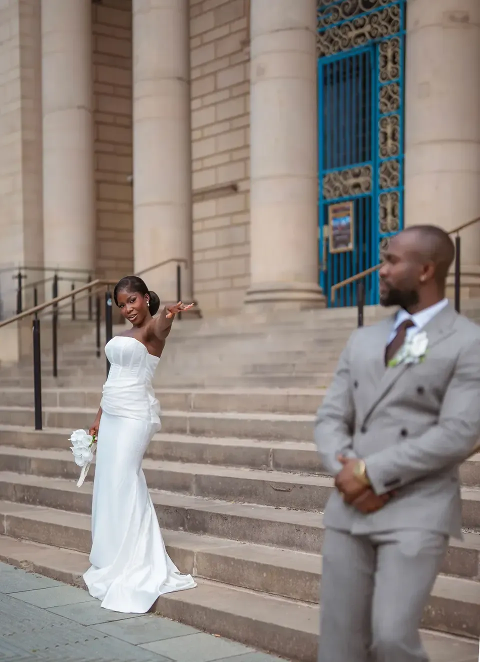 The couple outside a stone building
