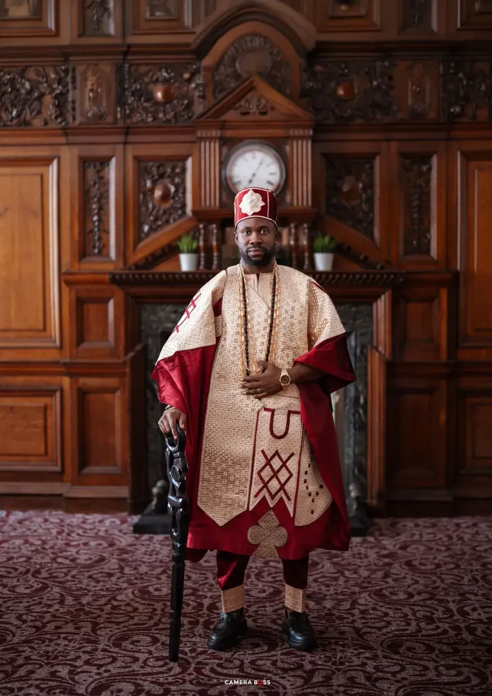 The groom in traditional red attire. CameraBoss portfolio: Opeyemi Wedding Portrait.