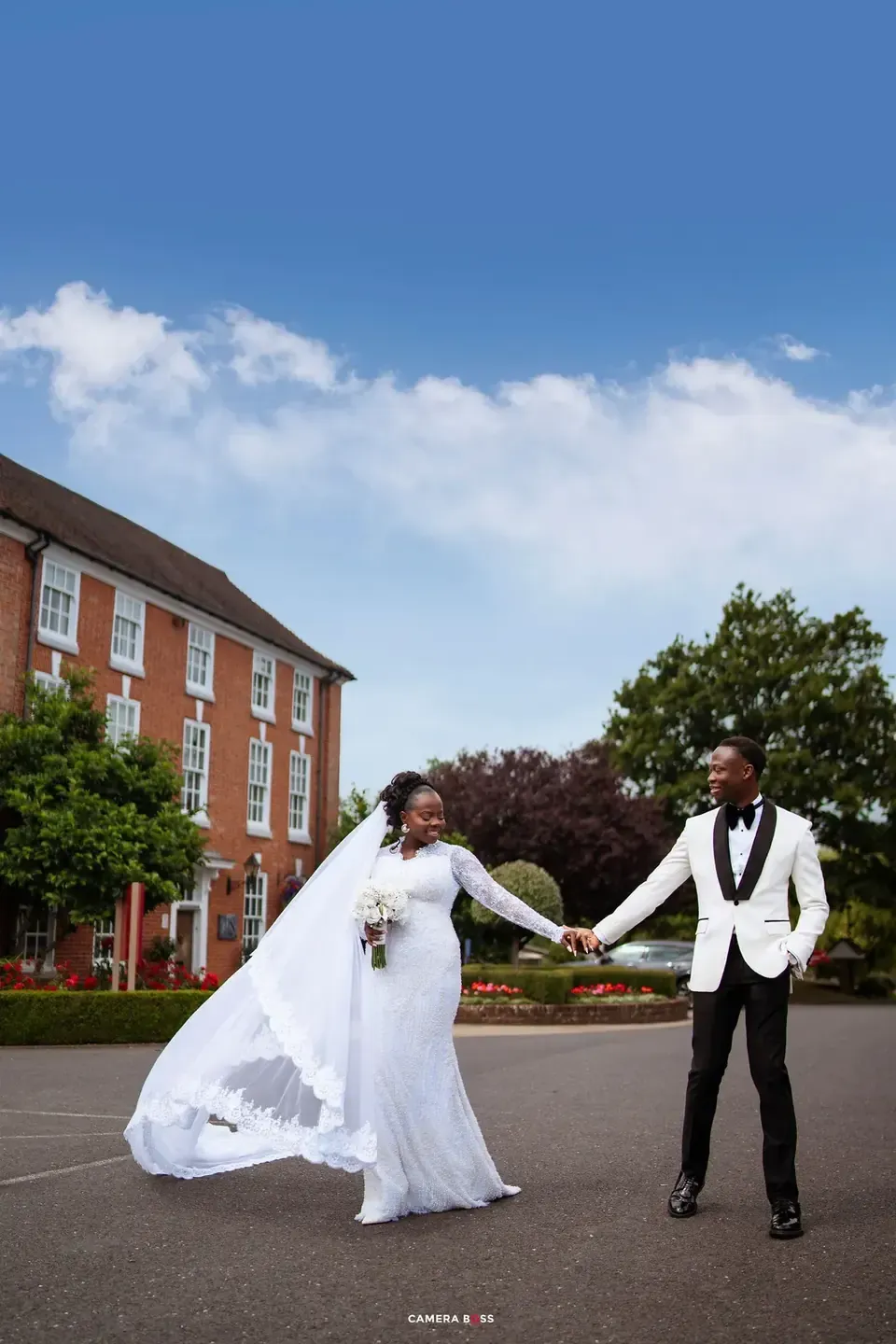 The couple walking together outdoors