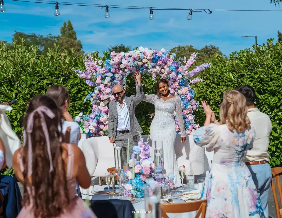 Guests gathered around the couple