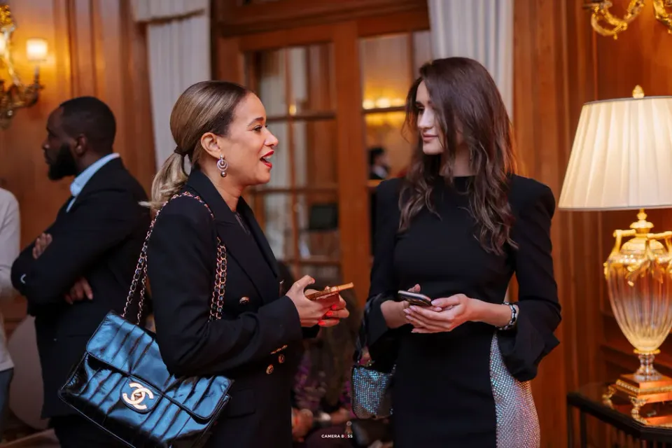 Two guests talking in the reception area at FLAIR Summit