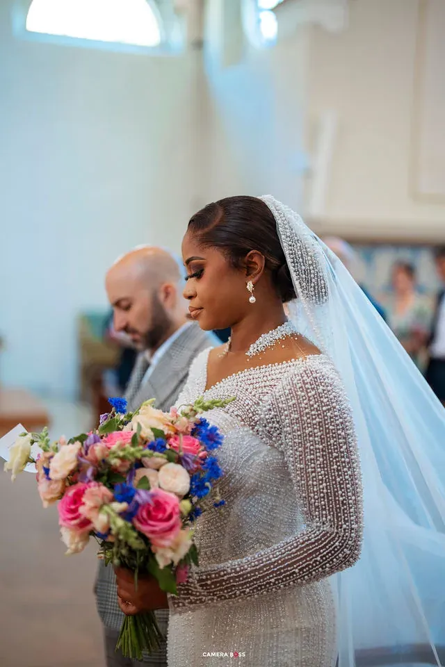 A side portrait of the bride seated during the ceremony. CameraBoss portfolio: Cynthia and Oswaldo.