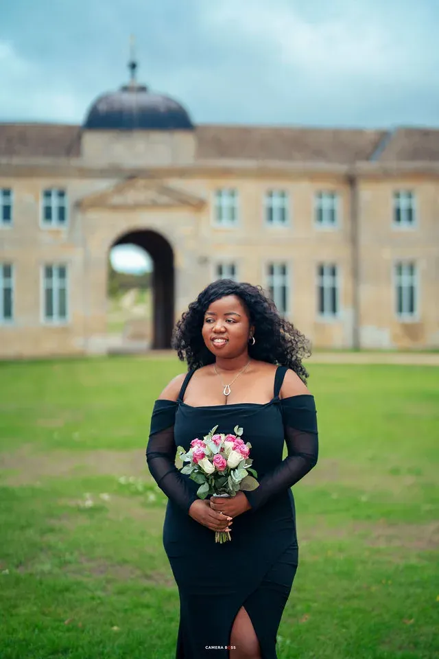 A pre-wedding portrait holding a bouquet outside Boughton House. CameraBoss portfolio: Oney Prewedding at Boughton House.