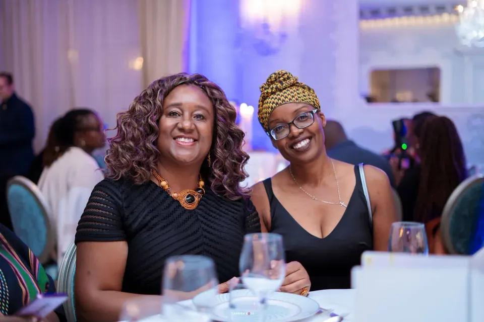 Two guests smiling together at the FLAIR Summit reception