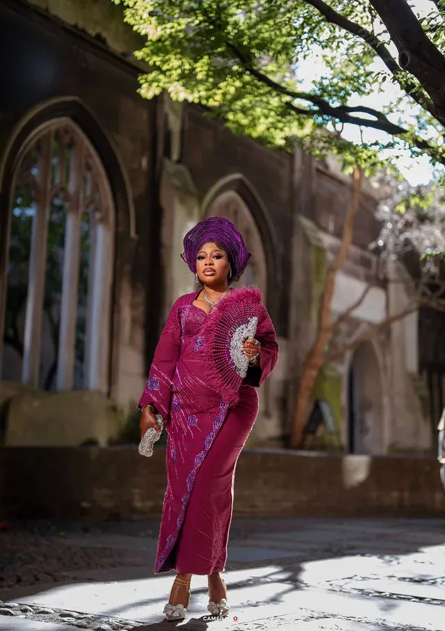 A pre-wedding portrait framed by a stone archway. CameraBoss portfolio: Korede Prewedding.