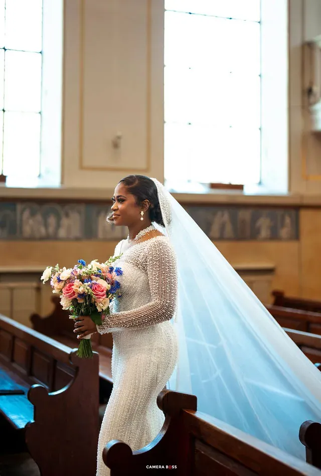 The bride walking into the ceremony with her bouquet. CameraBoss portfolio: Cynthia and Oswaldo.