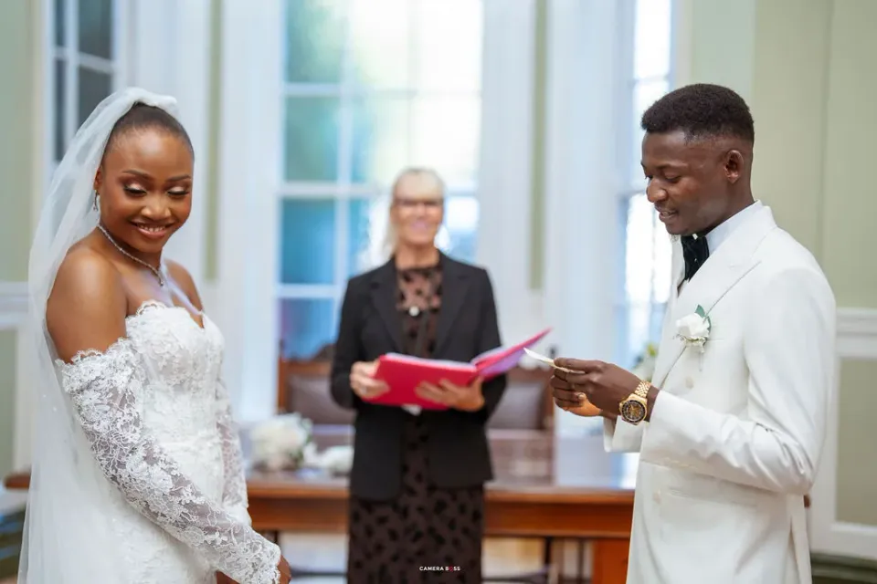 Daniel reading his vows as Remi smiles. CameraBoss portfolio: Remi and Daniel’s Bournemouth civil wedding.