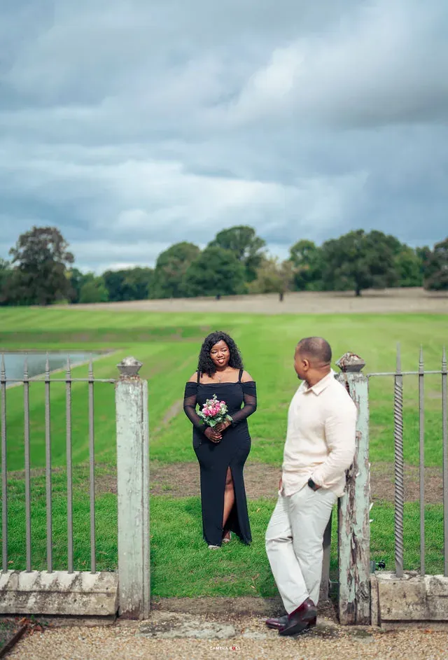 A couple beside the garden gate. CameraBoss portfolio: Oney Prewedding at Boughton House.