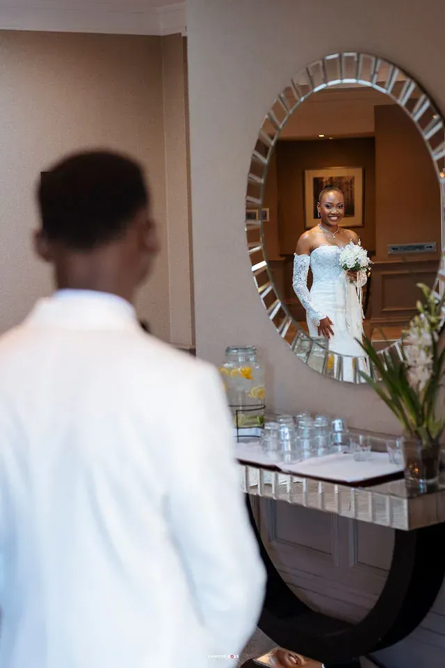 Daniel in the foreground with Remi reflected in the mirror