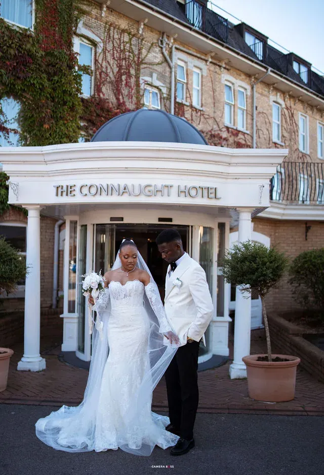 Remi and Daniel together outside The Connaught Hotel. CameraBoss portfolio: Remi and Daniel’s Bournemouth civil wedding.