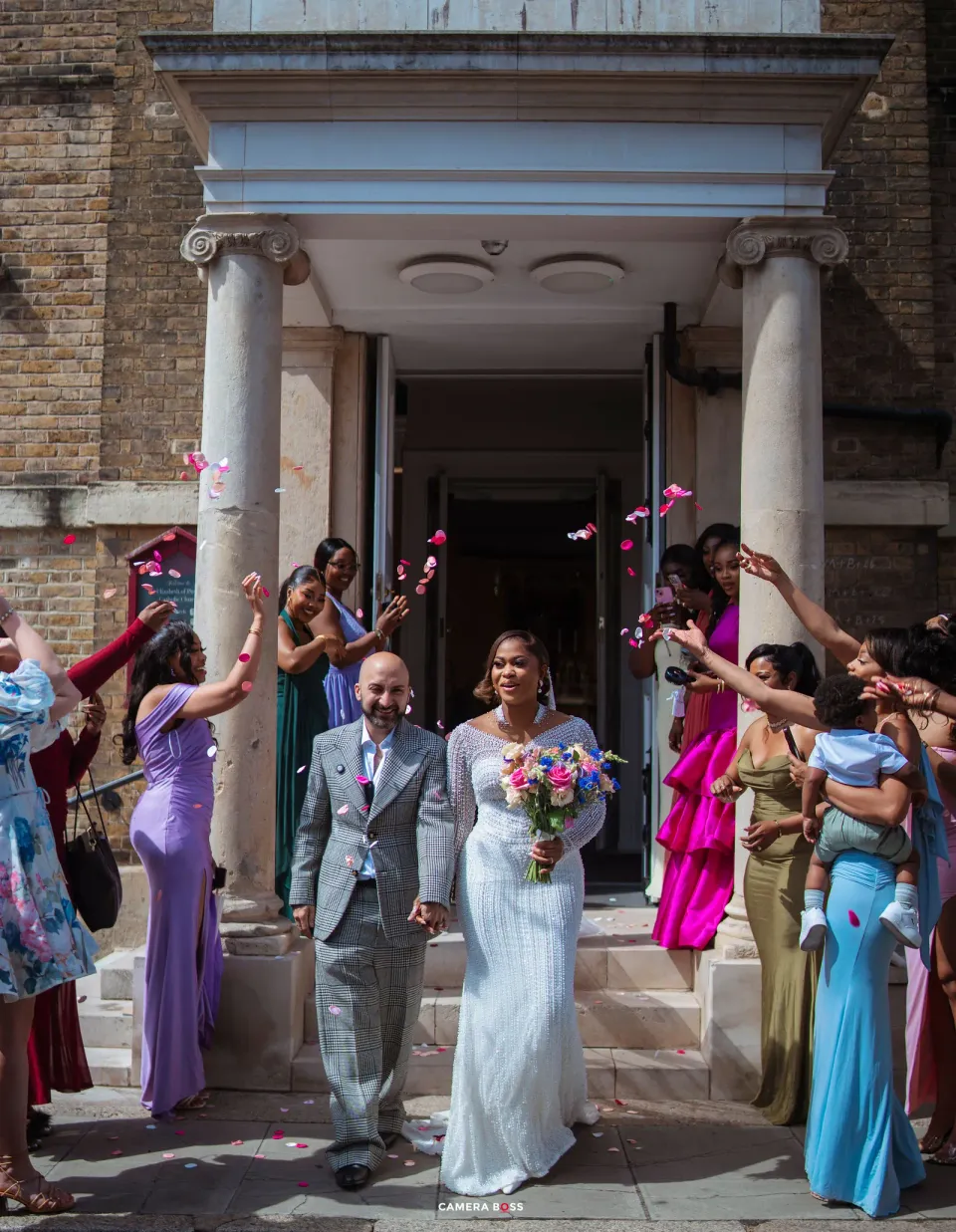 Cynthia and Oswaldo leaving their wedding celebration