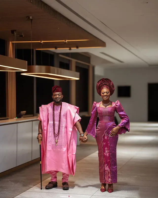 A couple holding hands indoors. CameraBoss portfolio: Tolu Prewedding Birmingham.