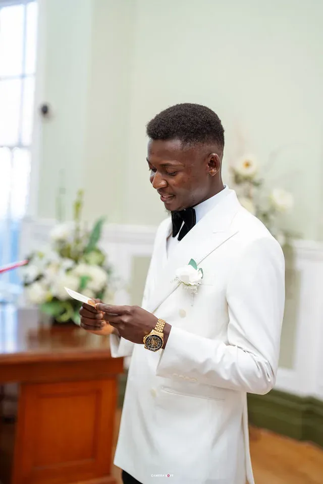 Daniel reading from a card during his vows. CameraBoss portfolio: Remi and Daniel’s Bournemouth civil wedding.