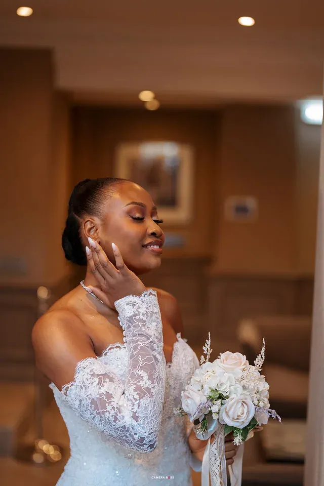Remi holding her bouquet in a close bridal portrait. CameraBoss portfolio: Remi and Daniel’s Bournemouth civil wedding.