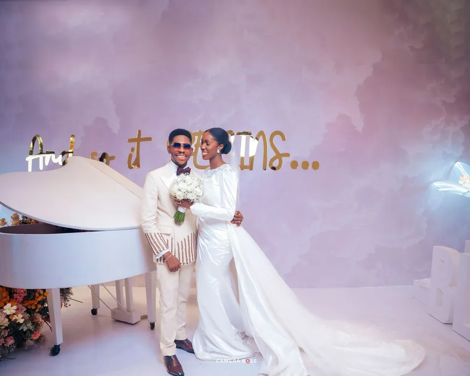 Moses and Marie celebrating their wedding