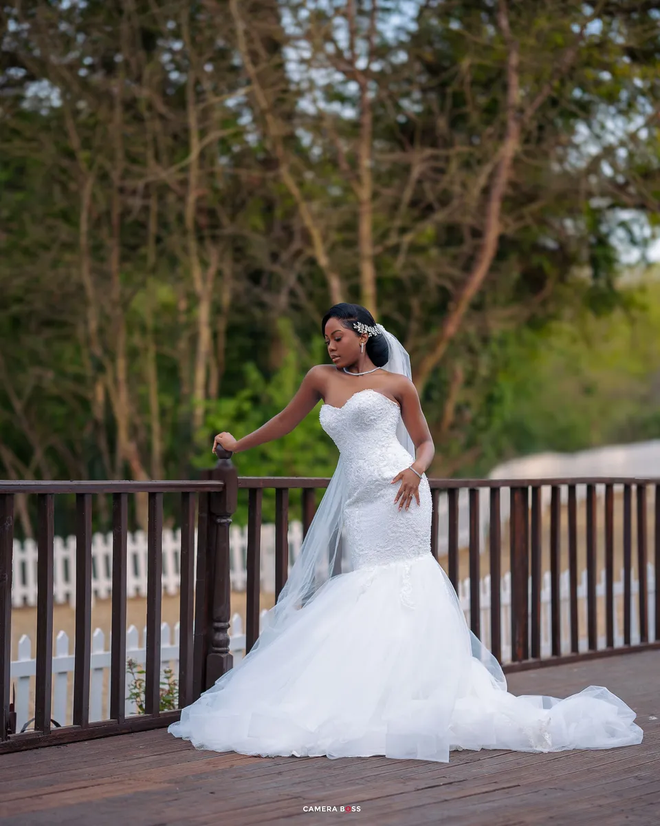 Bride in a white gown on a terrace